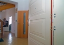 ADLO - Security door ADUO, panel design K 203, slat finishing on panels KV - 2, surface RAL 9003