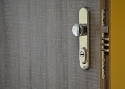ADLO - Security door TEDUO, plain door design, door surface H1151, oval security fitting